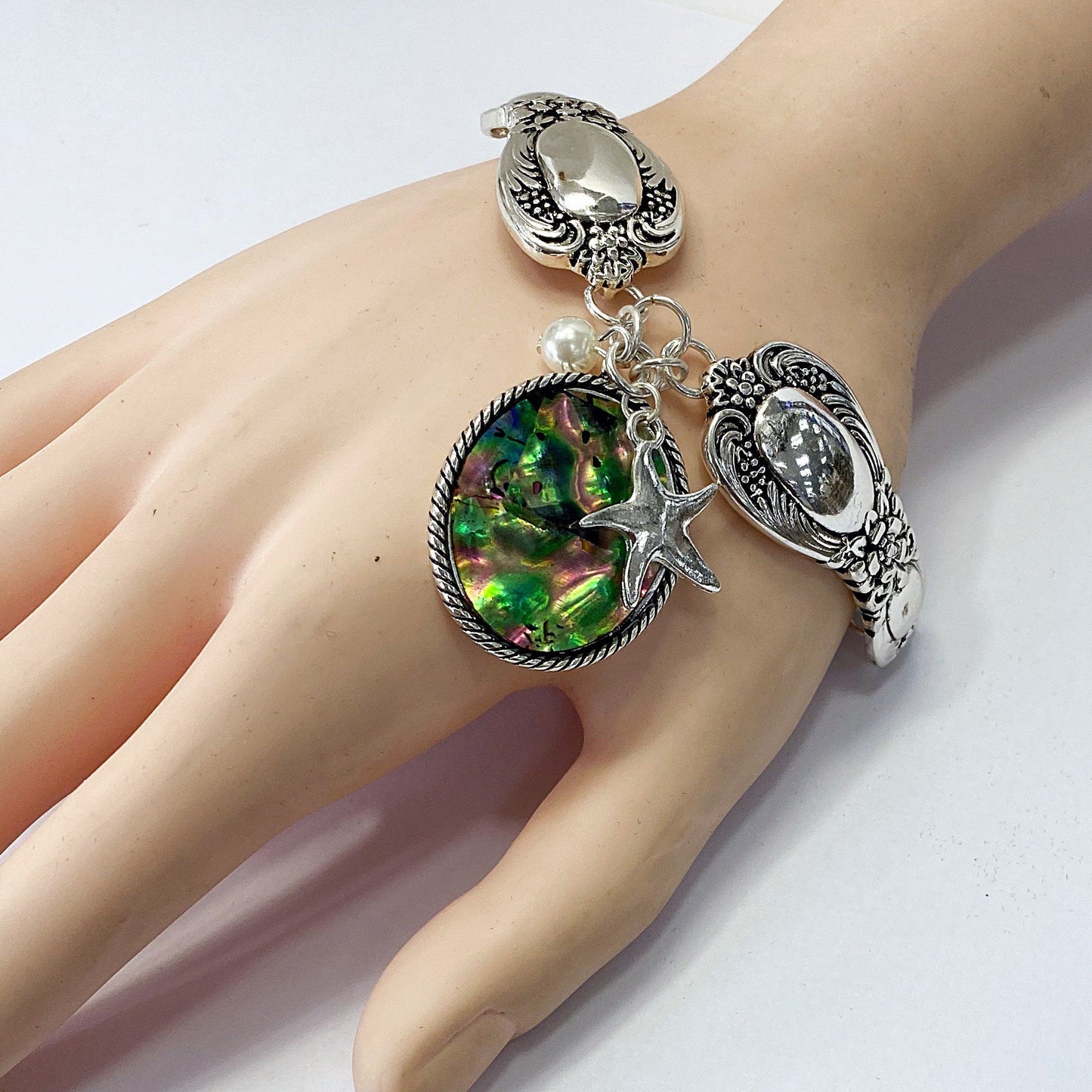 B0164 BB00437 Mother of Pearl Accented Starfish Shape Charms Bracelet