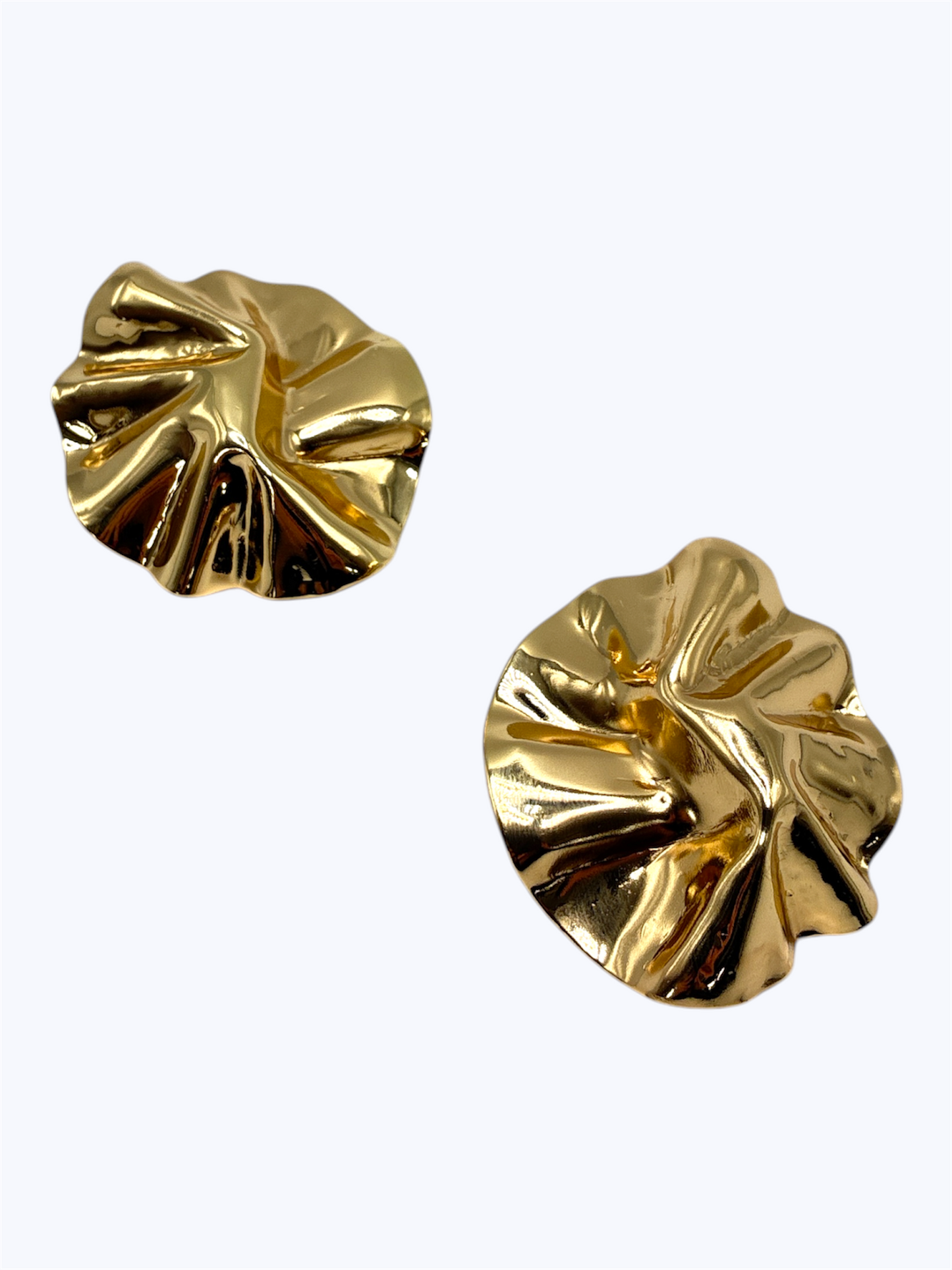 Pair of gold earrings on a white background