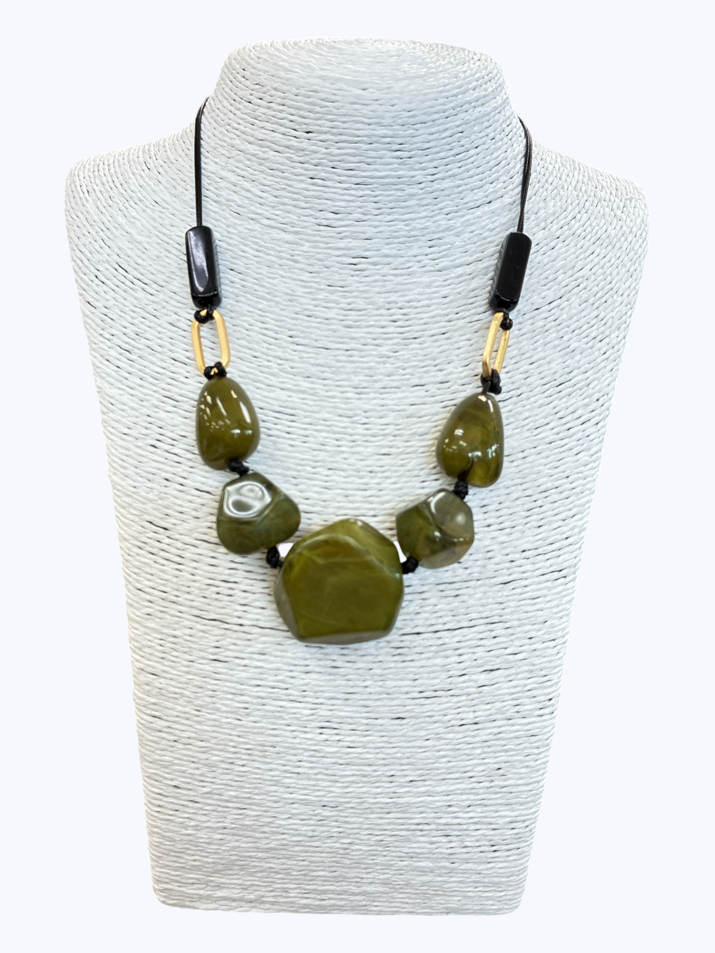 Olive green statement bead necklace with glossy marbled resin stones, black cord, and gold-tone accents for an earthy boutique-inspired look.