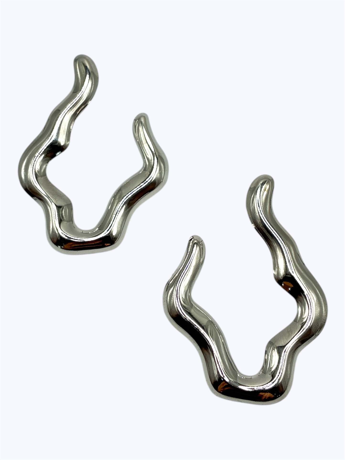 Pair of silver wave-shaped earrings on a white background