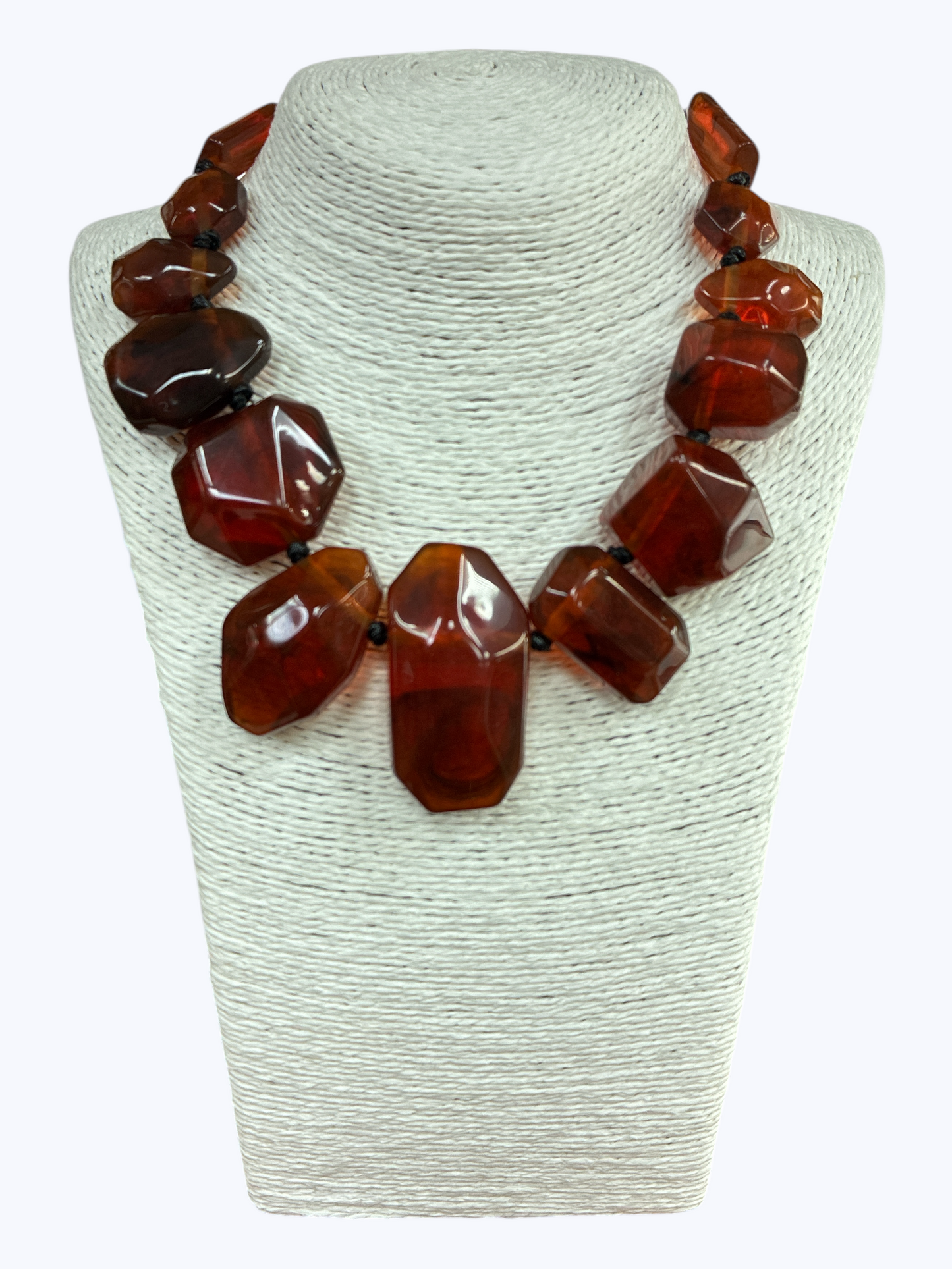 Chunky geometric acrylic necklace featuring oversized translucent faceted beads in a bold modern statement design.