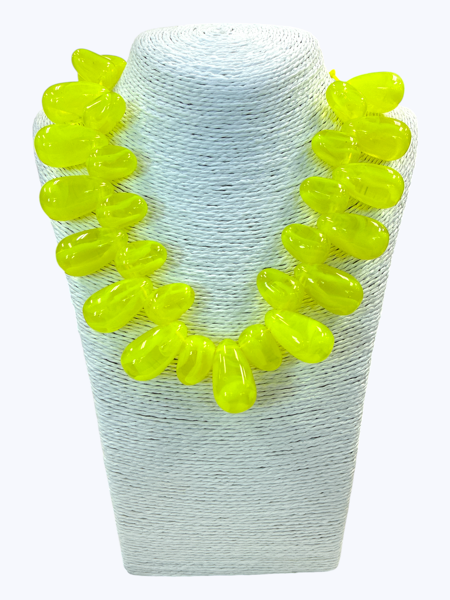 Neon green beaded necklace on a white mannequin bust.