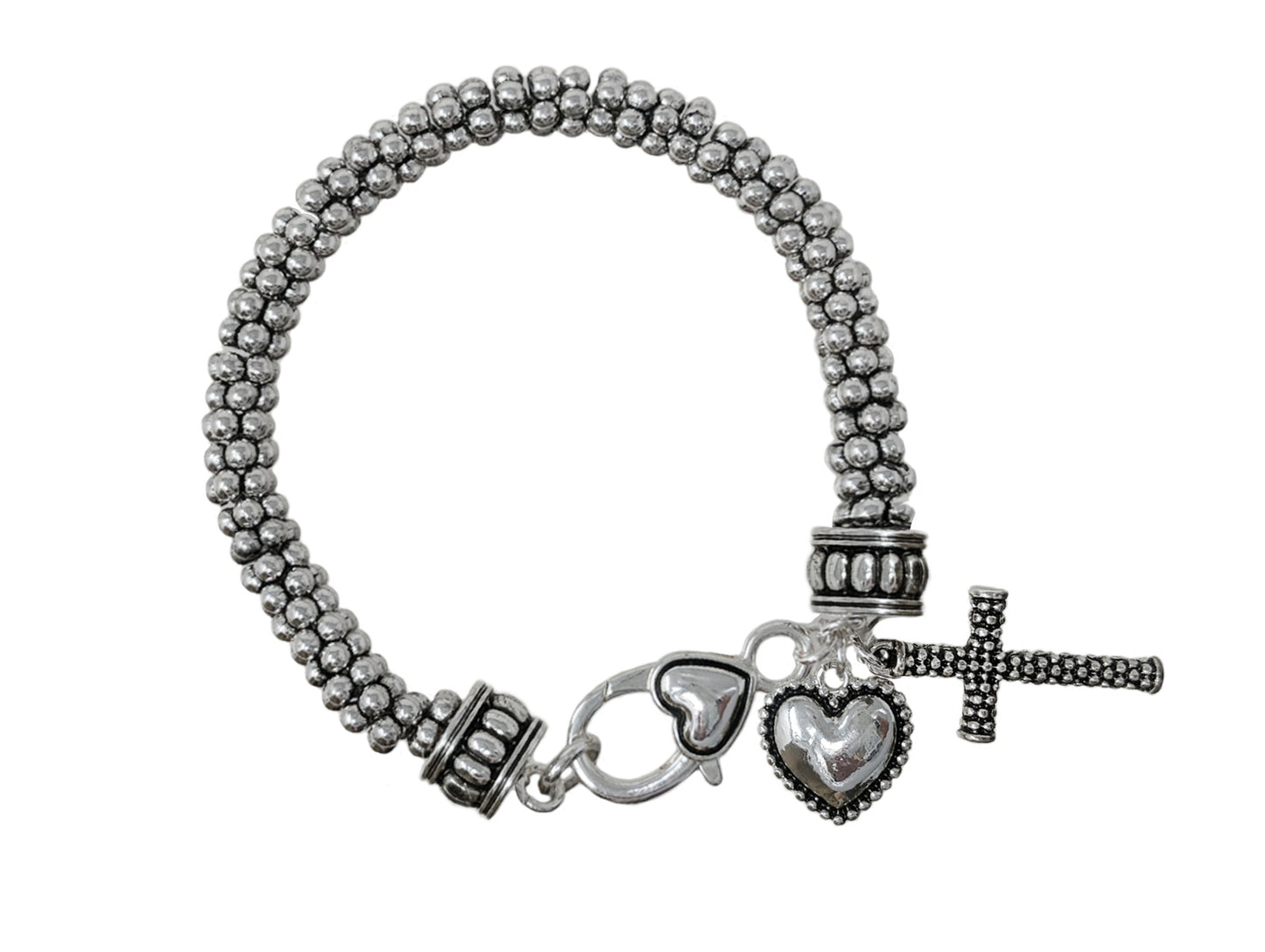 Antique silver-tone beaded bracelet featuring cross and heart charms with textured multi-strand metal bead detailing.