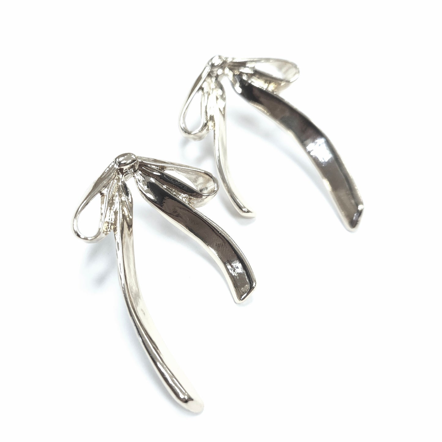 Silver wishbone-shaped earrings on a white background