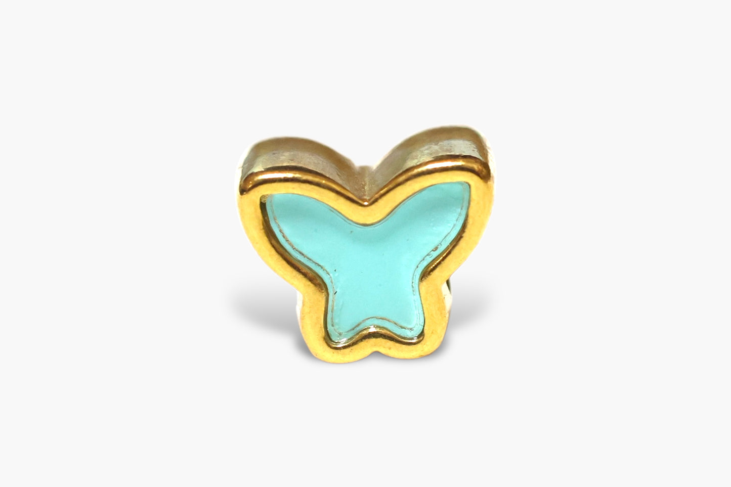 Butterfly-shaped object with gold border and light blue center on a white background