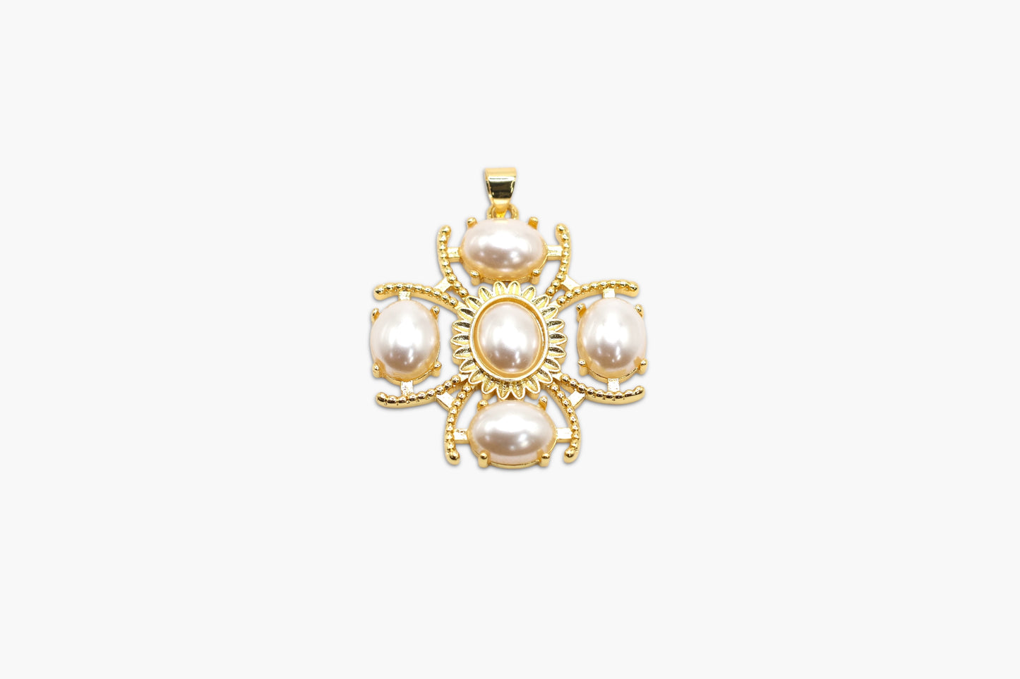 Gold pendant with pearls on a white background