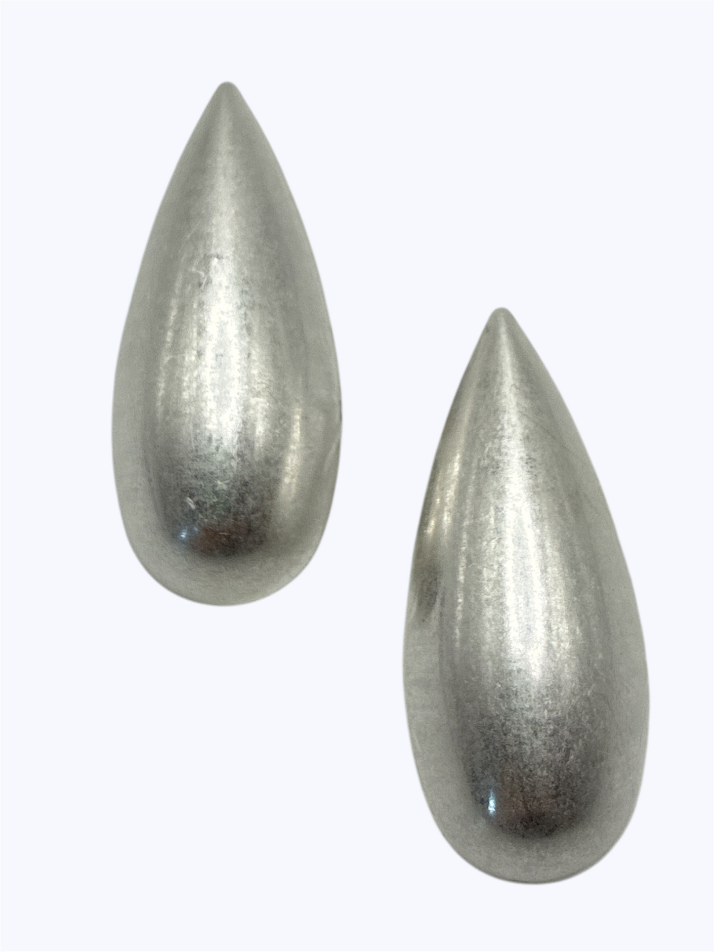 Polished silver teardrop stud earrings with a modern minimalist silhouette