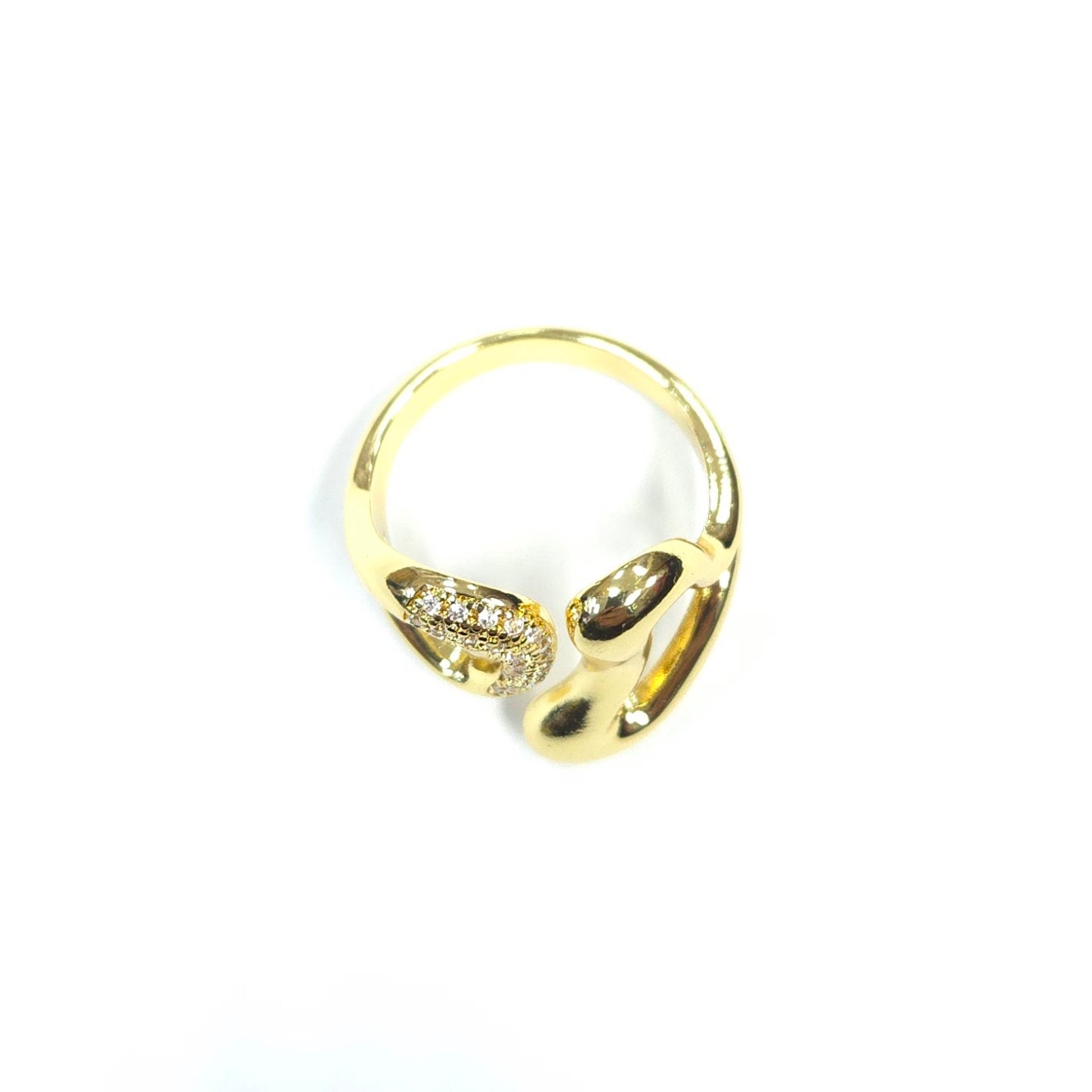 Gold ring with a clear stone on a white background