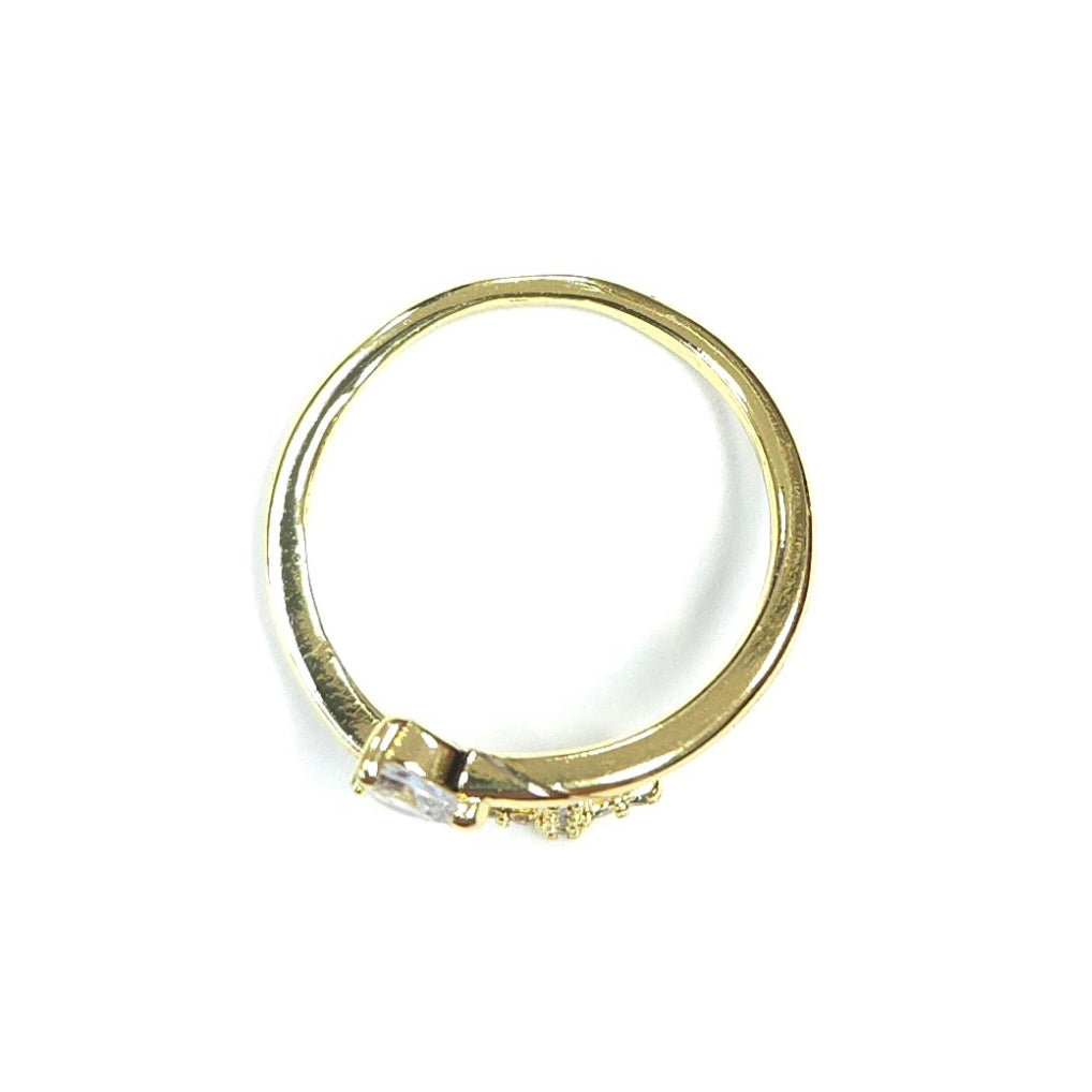 Gold ring with a diamond on a white background
