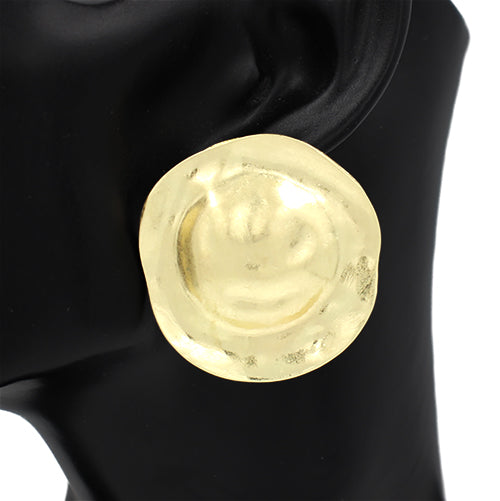 Gold round earring on a black mannequin