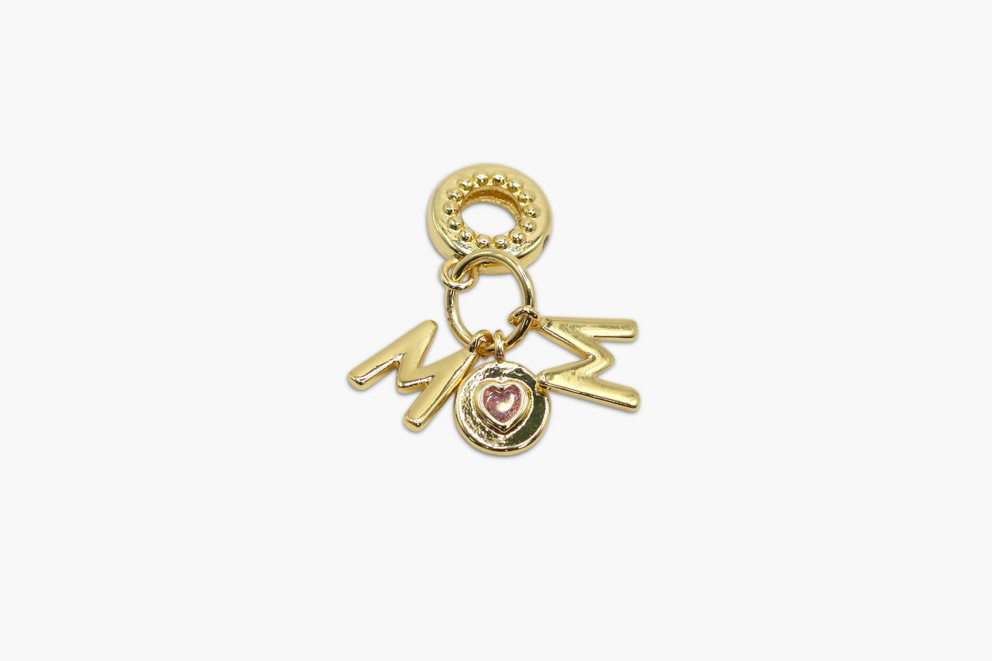 Gold charm with 'MOM' and heart details on a white background