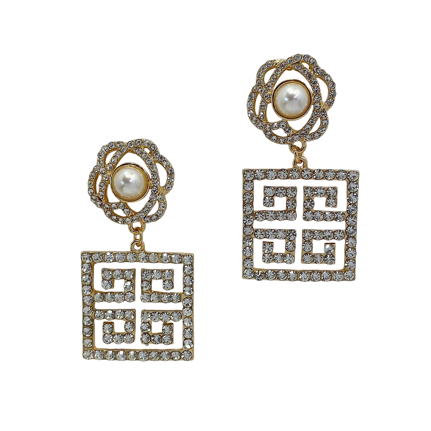 Pair of earrings with geometric designs and pearl-like centers on a white background