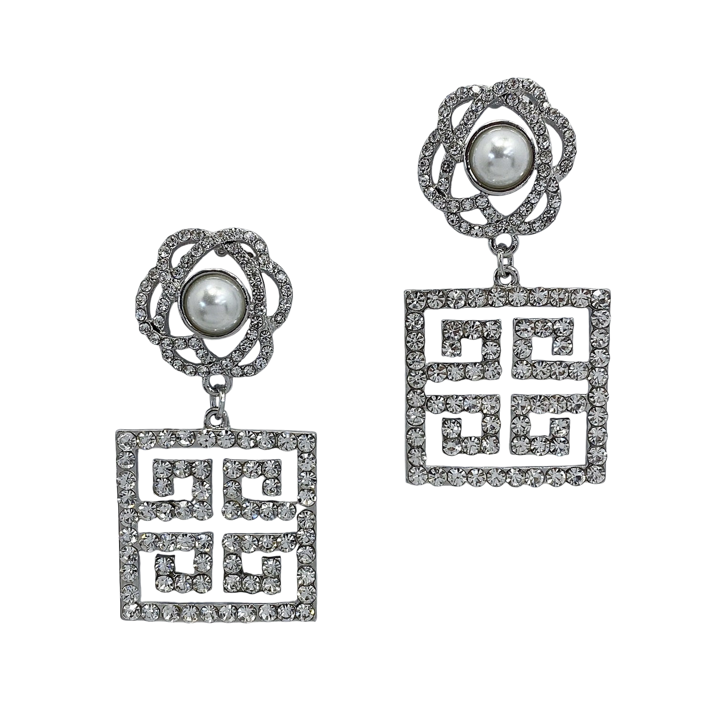 Pair of earrings with geometric designs and pearl-like centers on a white background