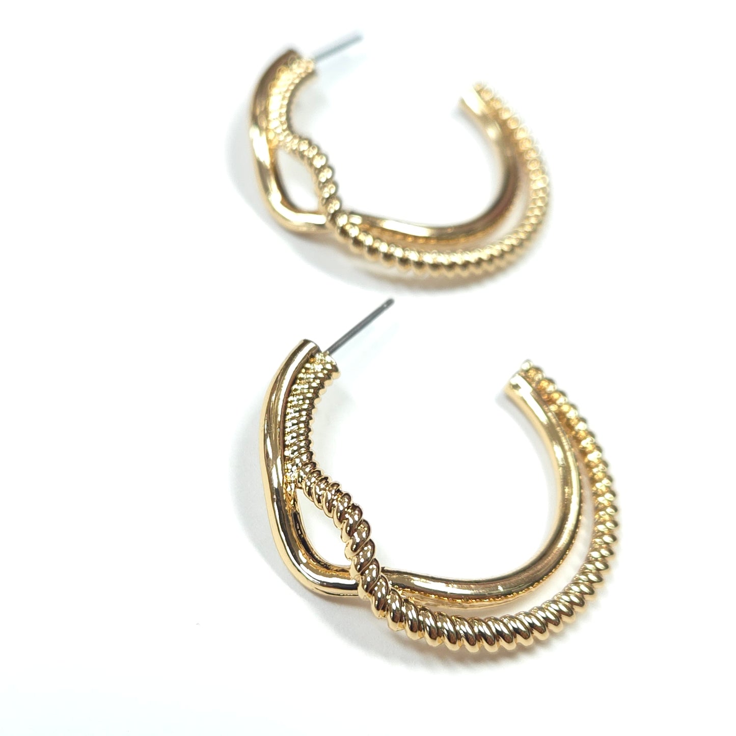 Gold hoop earrings with beaded detailing on a white background