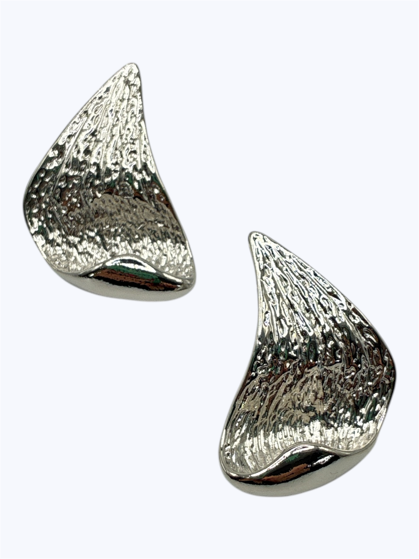 Sculpted textured stud earrings with abstract curved shell-inspired organic design.