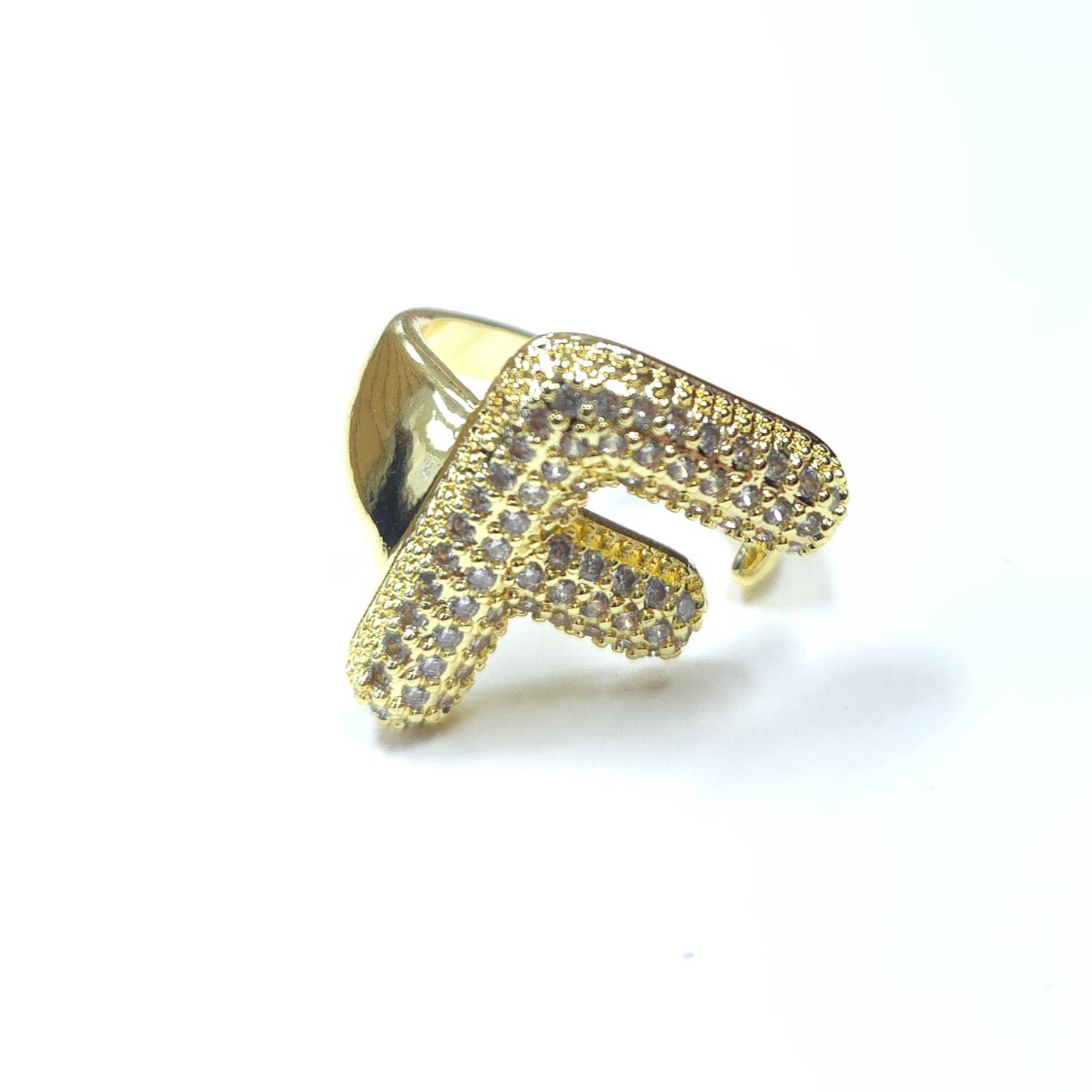 Gold ring with letter 'F' design on a white background