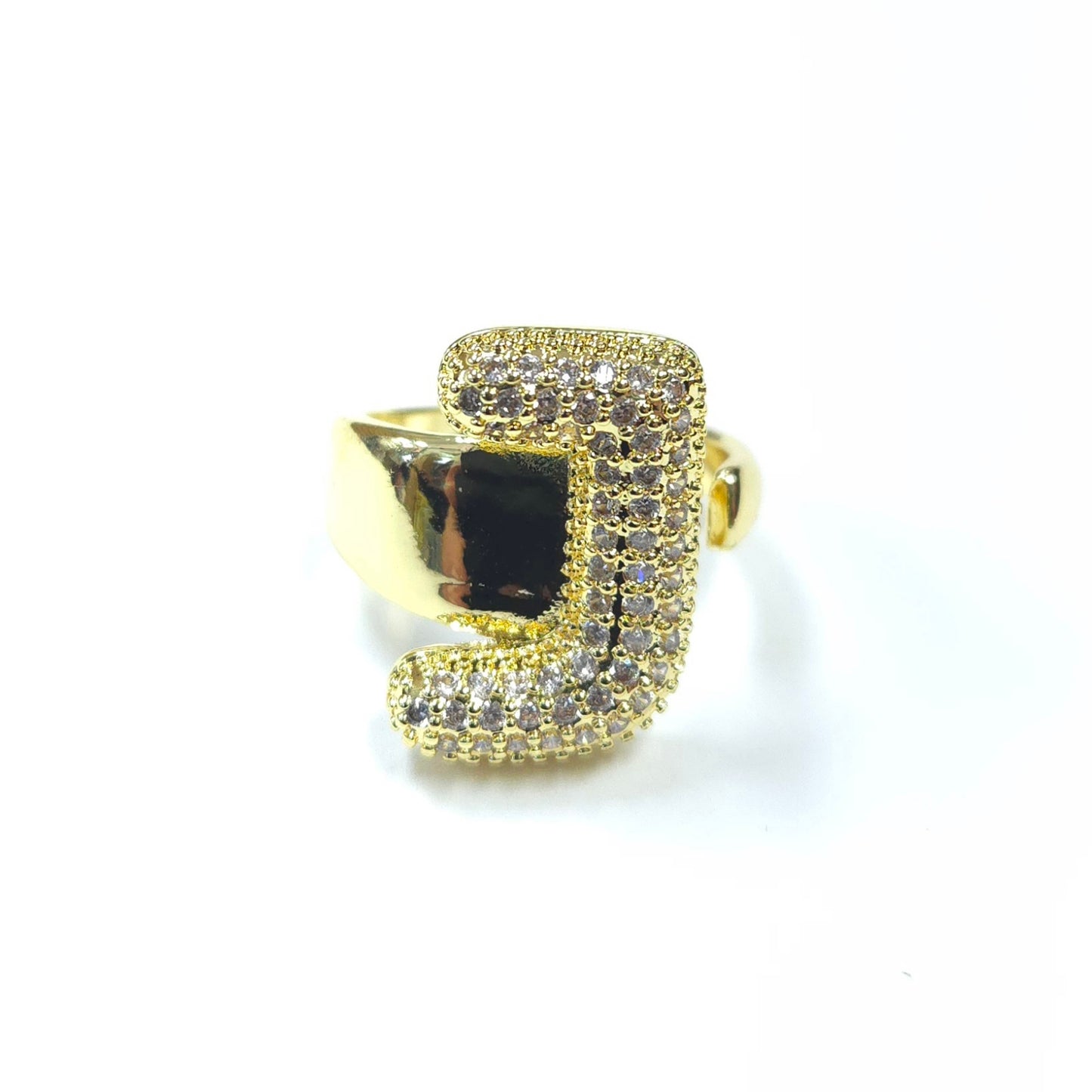 Gold ring with gemstones on a white background