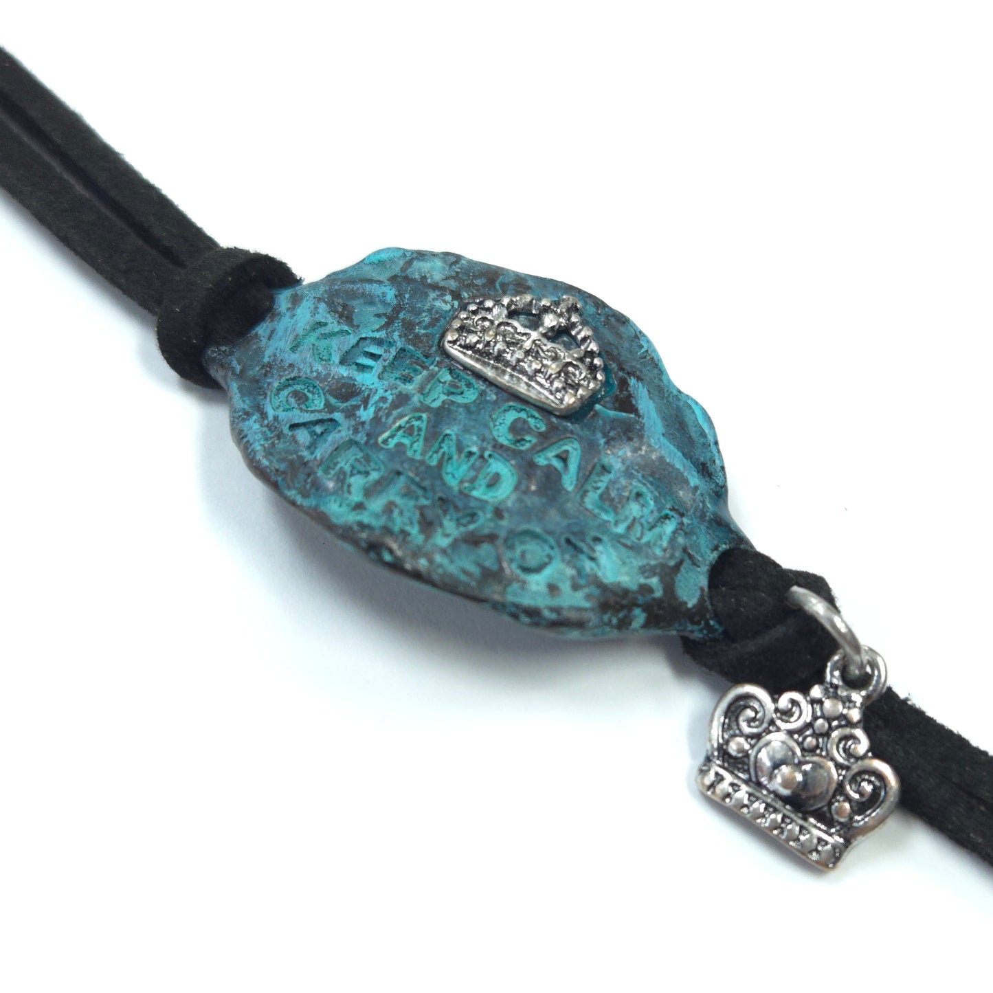 Necklace with a turquoise stone and silver heart charm on a white background
