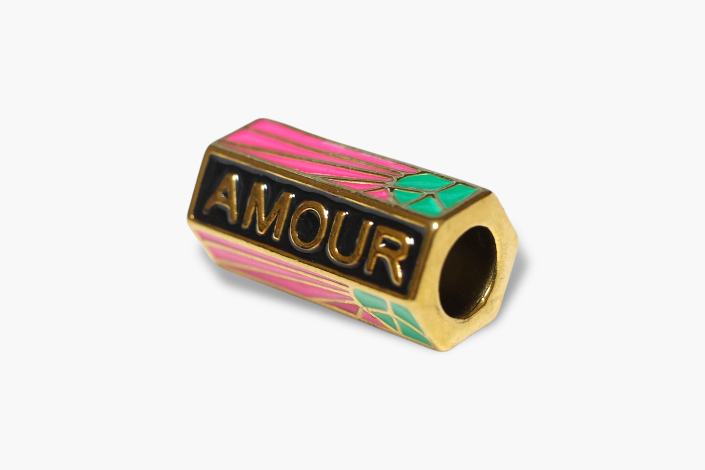 Gold charm with 'AMOUR' text on a white background