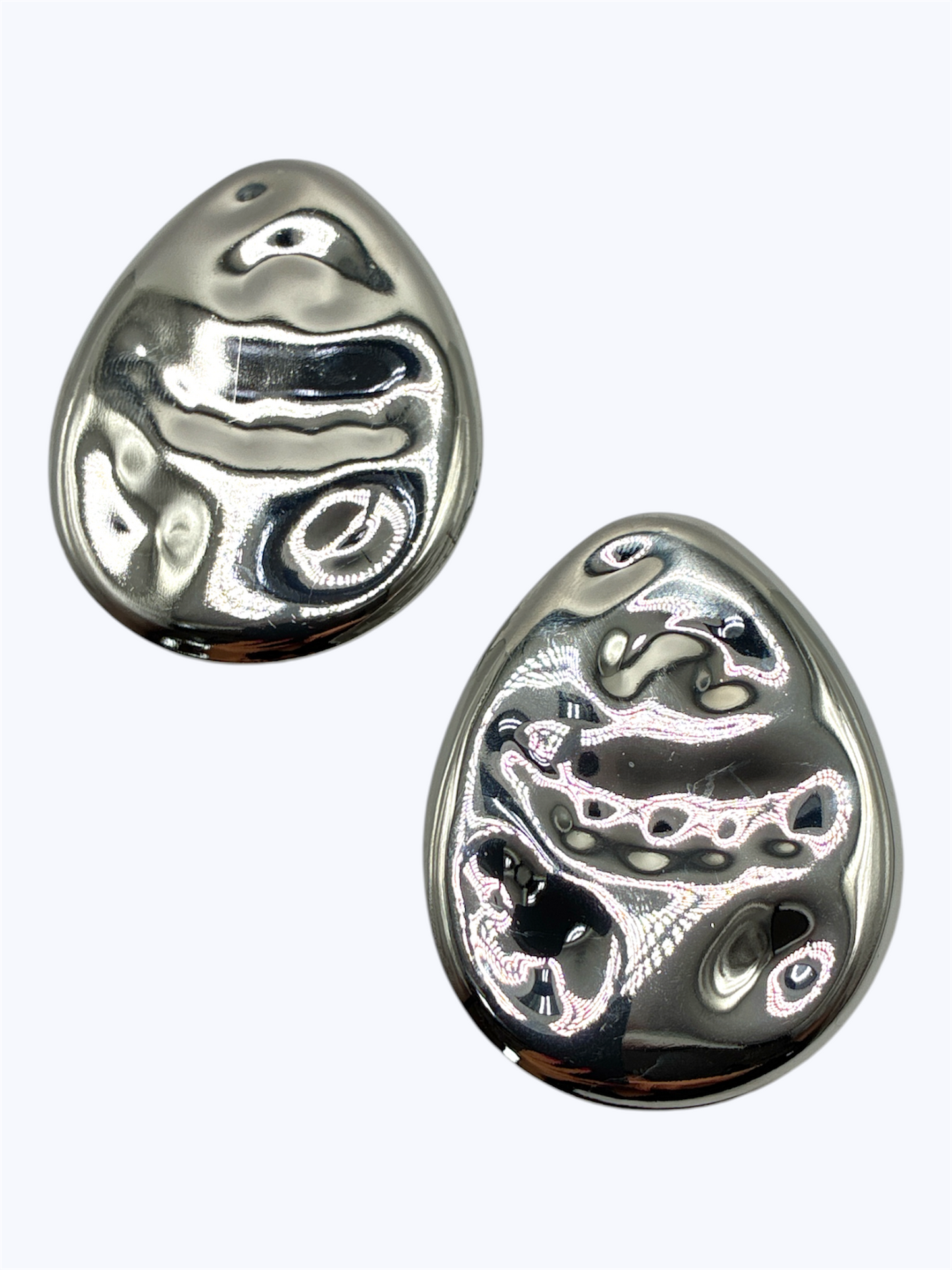 Abstract hammered teardrop stud earrings with sculpted textured metal finish and modern boutique style.