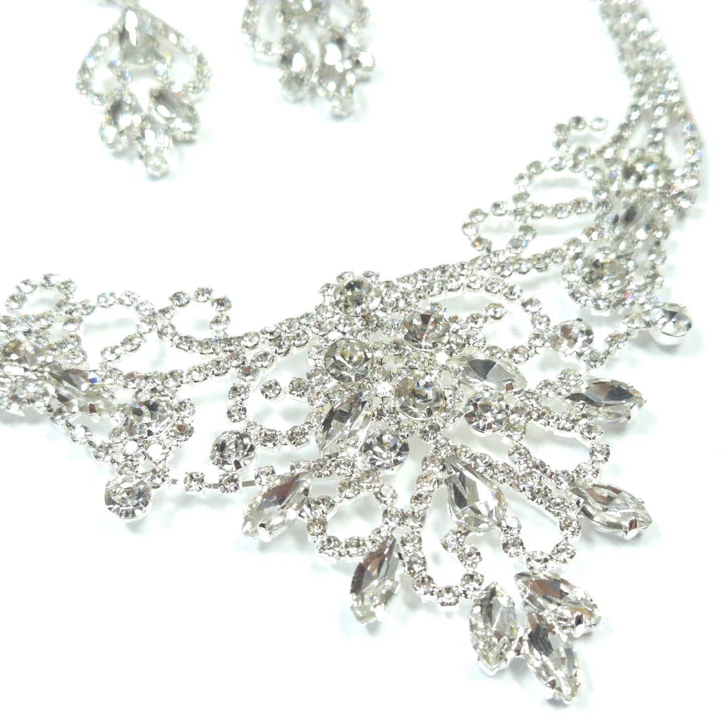 Silver jewelry with crystals on a white background