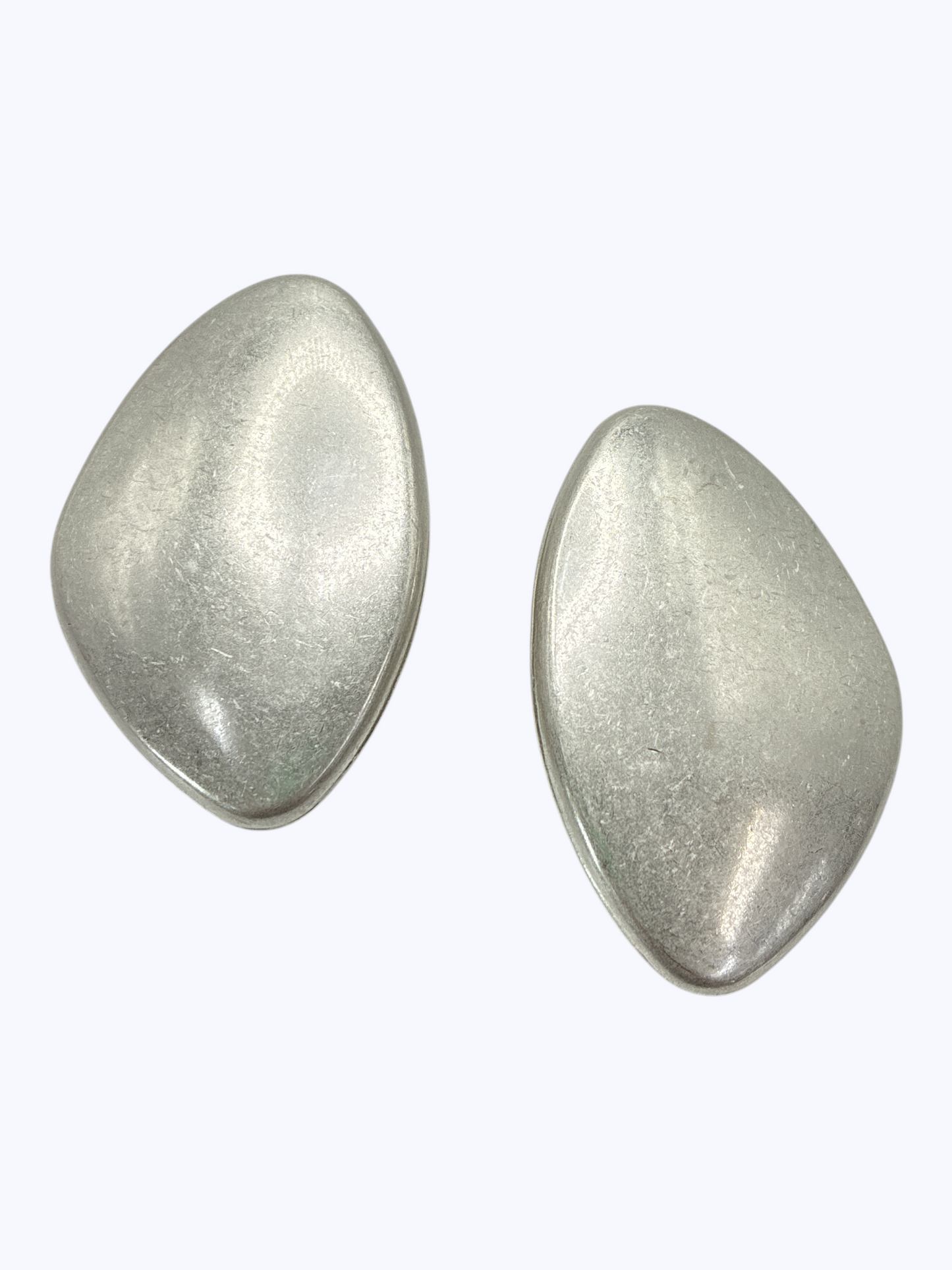 Modern organic-shaped stud earrings featuring smooth sculptural matte metal design with minimalist contemporary styling.