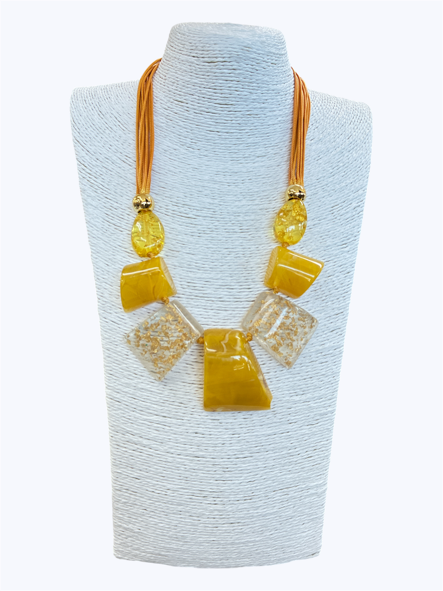 Mustard yellow statement necklace with glossy geometric resin accents, gold fleck details, and layered cord strands for a bold artistic boutique look.