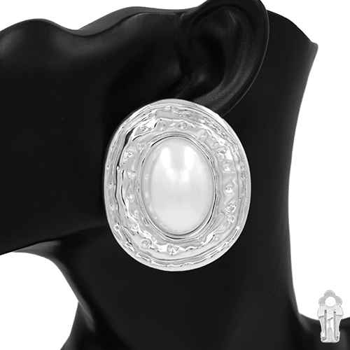Pearl earring on a black mannequin with a white background