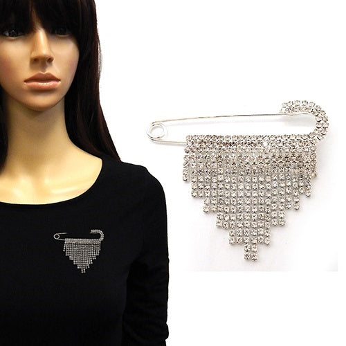 Mannequin wearing a black top with a decorative brooch, next to a close-up of the brooch on a white background.