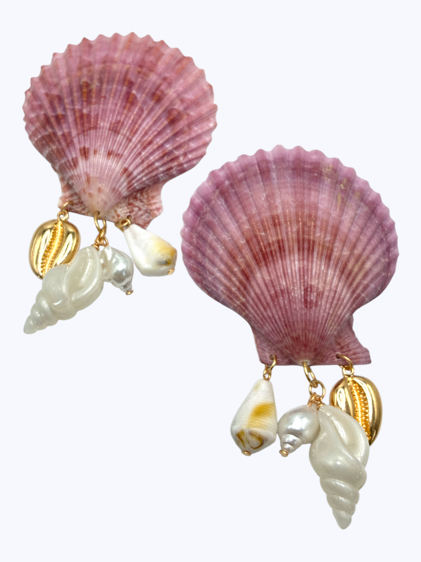Large scallop shell earrings with dangling shell charms and gold tone accents in a coastal inspired statement design.