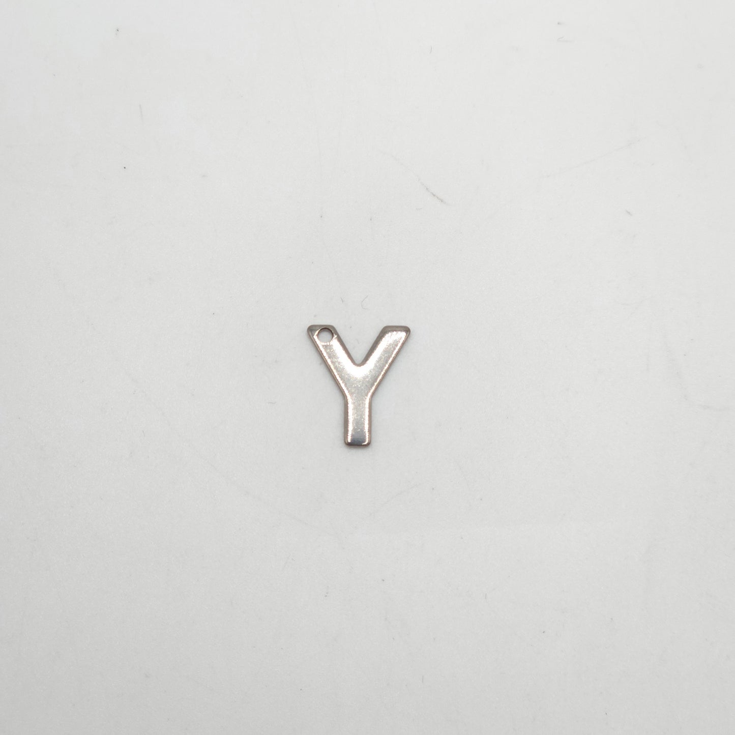 Silver letter 'Y' charm on a light gray background