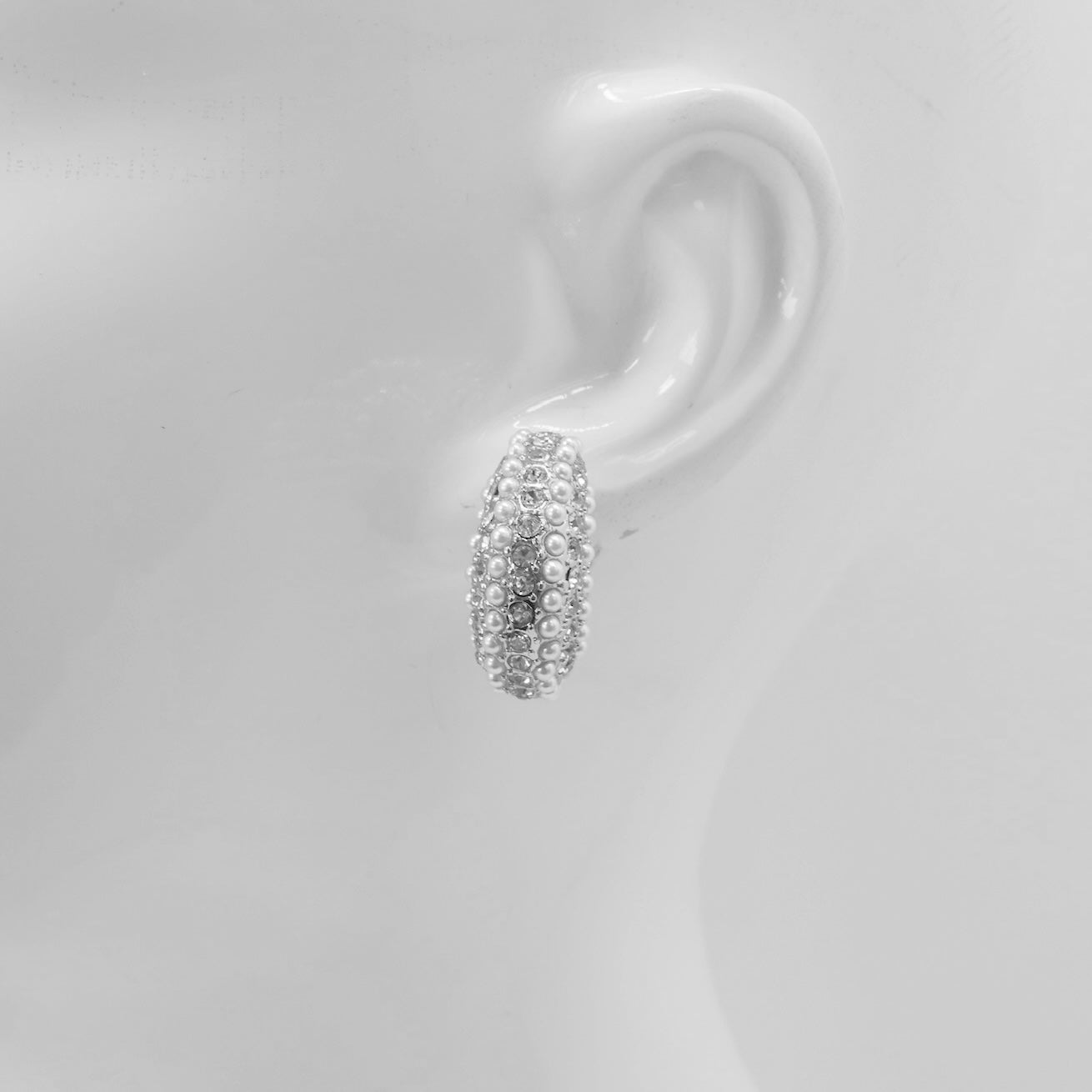 Open hoop earrings with crystal pave detailing and pearl accents in a glamorous boutique fashion style.