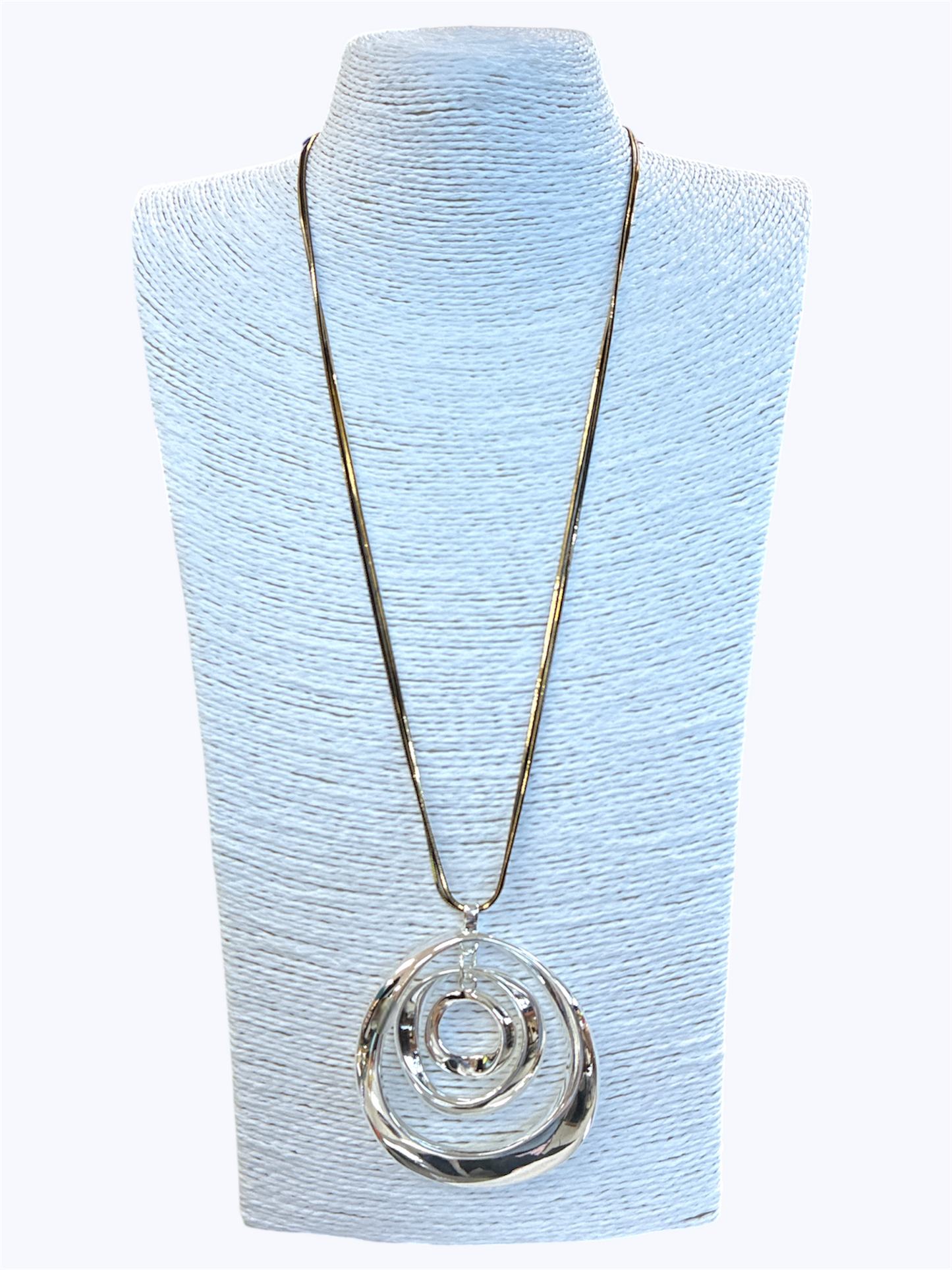 Necklace with a silver pendant on a light blue mannequin bust
