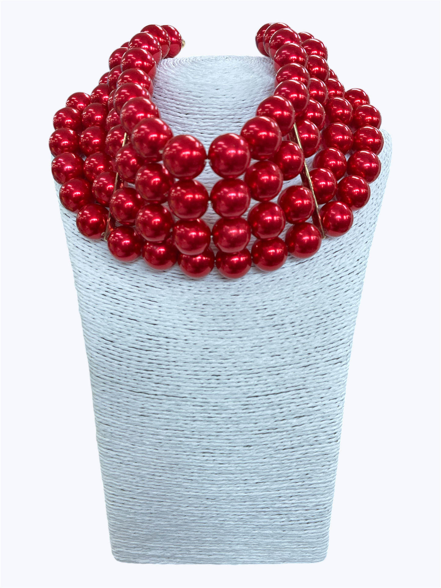 Layered chunky faux pearl statement necklace featuring multiple strands of glossy oversized pearl beads in a dramatic collar silhouette.