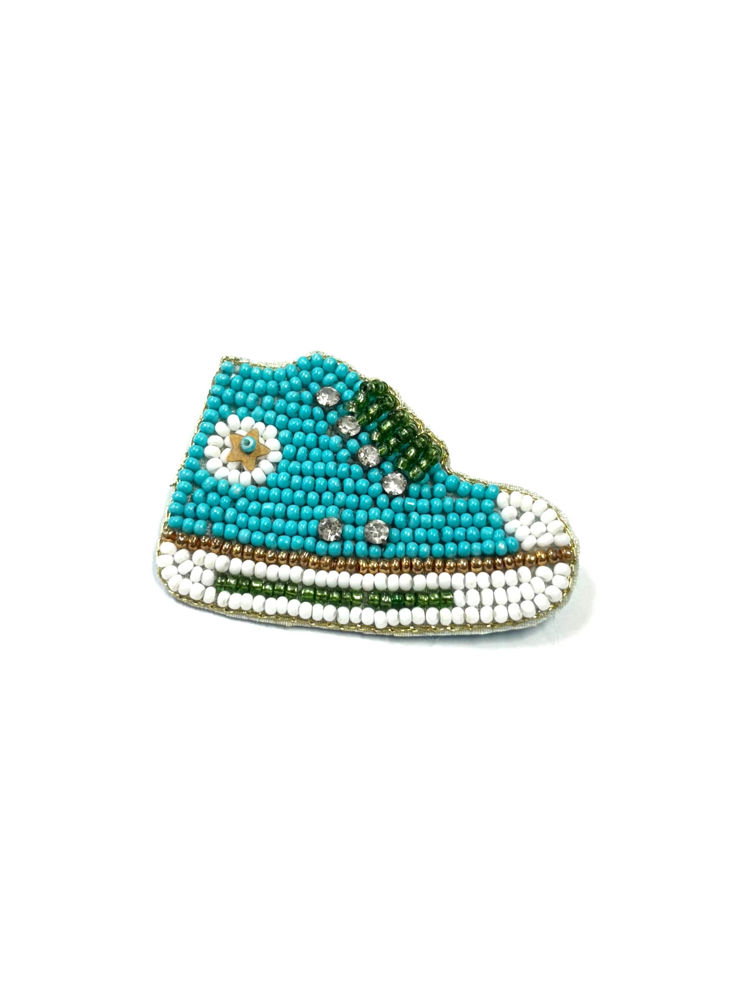 Beaded shoe ornament with turquoise top and white sole on a white background