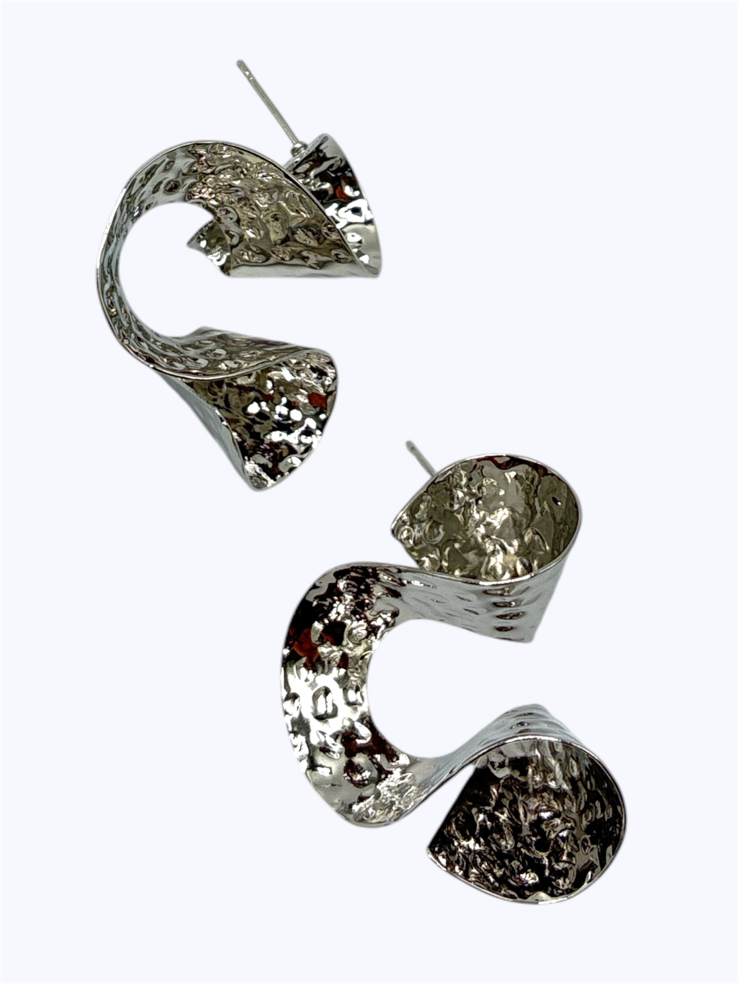 Pair of silver earrings on a white background