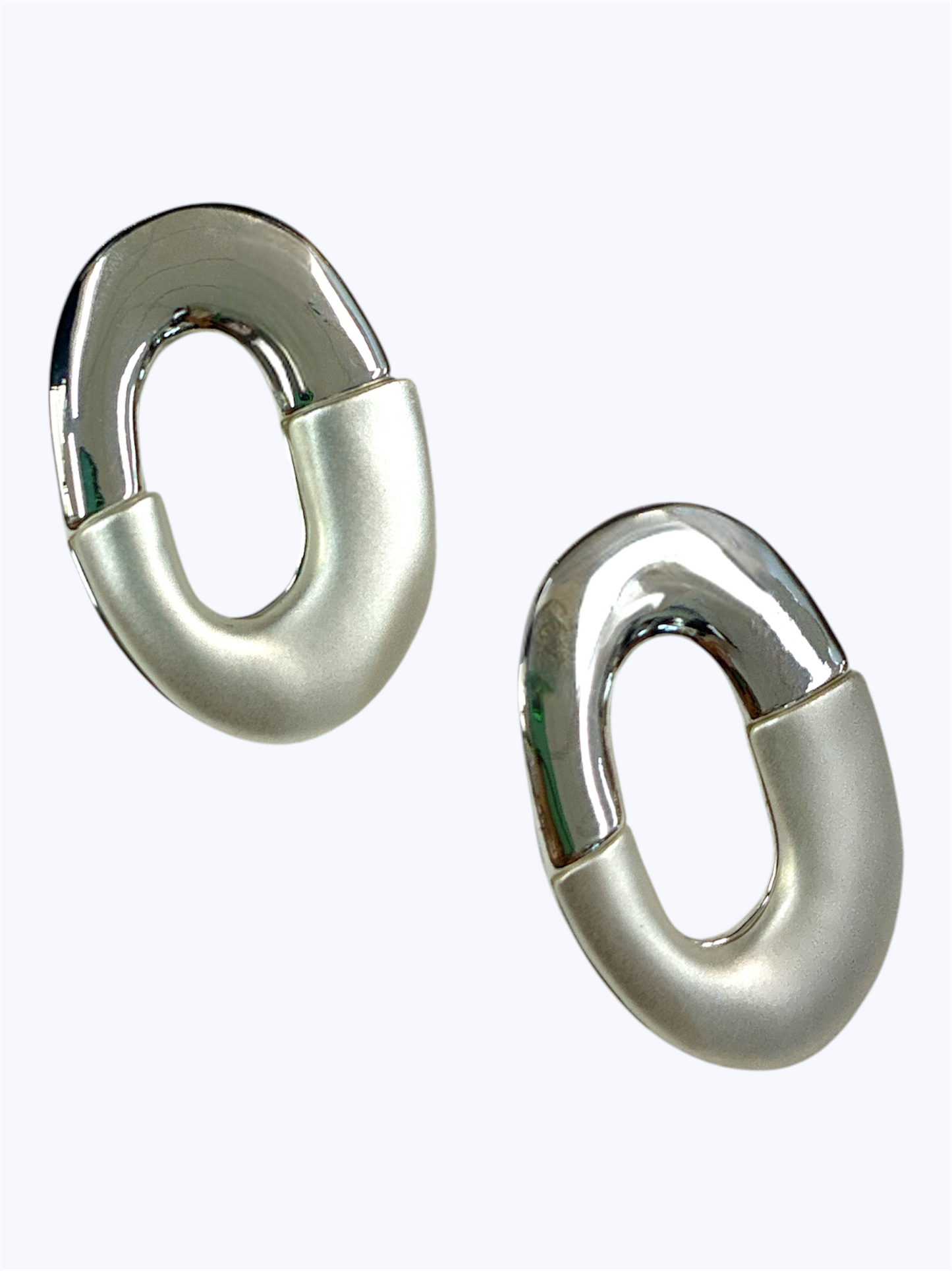 Silver oval link earrings with a polished and matte finish in a modern chunky minimalist style