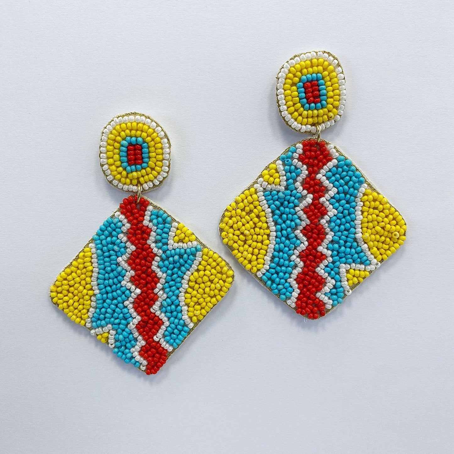 A vibrant earring on a white background