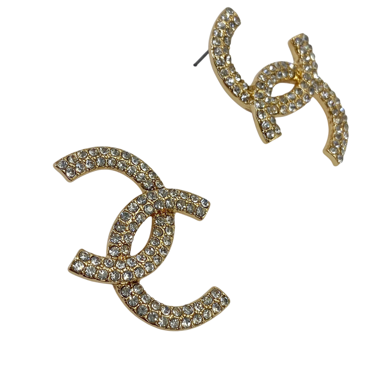 Gold earrings with rhinestone embellishments on a white background