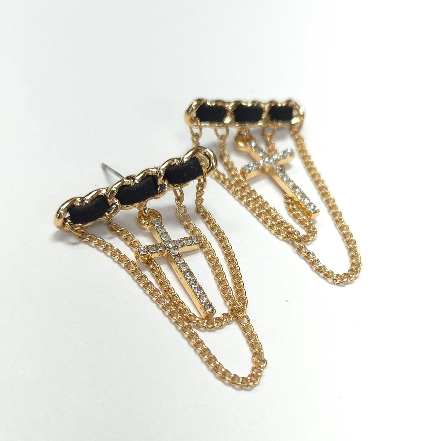 Gold chain earrings with black accents on a white background