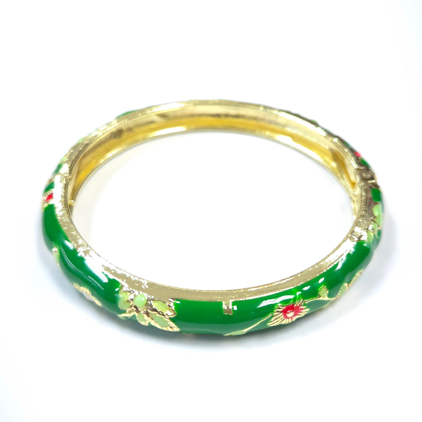 Green bangle with floral patterns on a white background