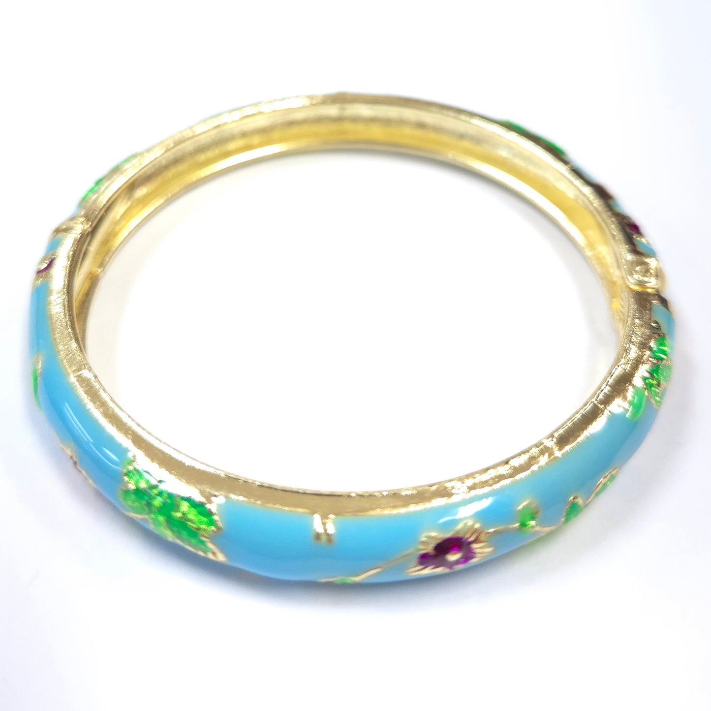 Decorative bangle with gold rim and blue center on a white background