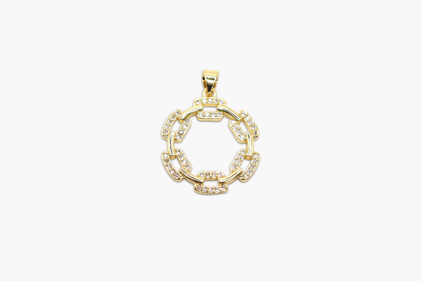 Gold pendant with circular design on a white background
