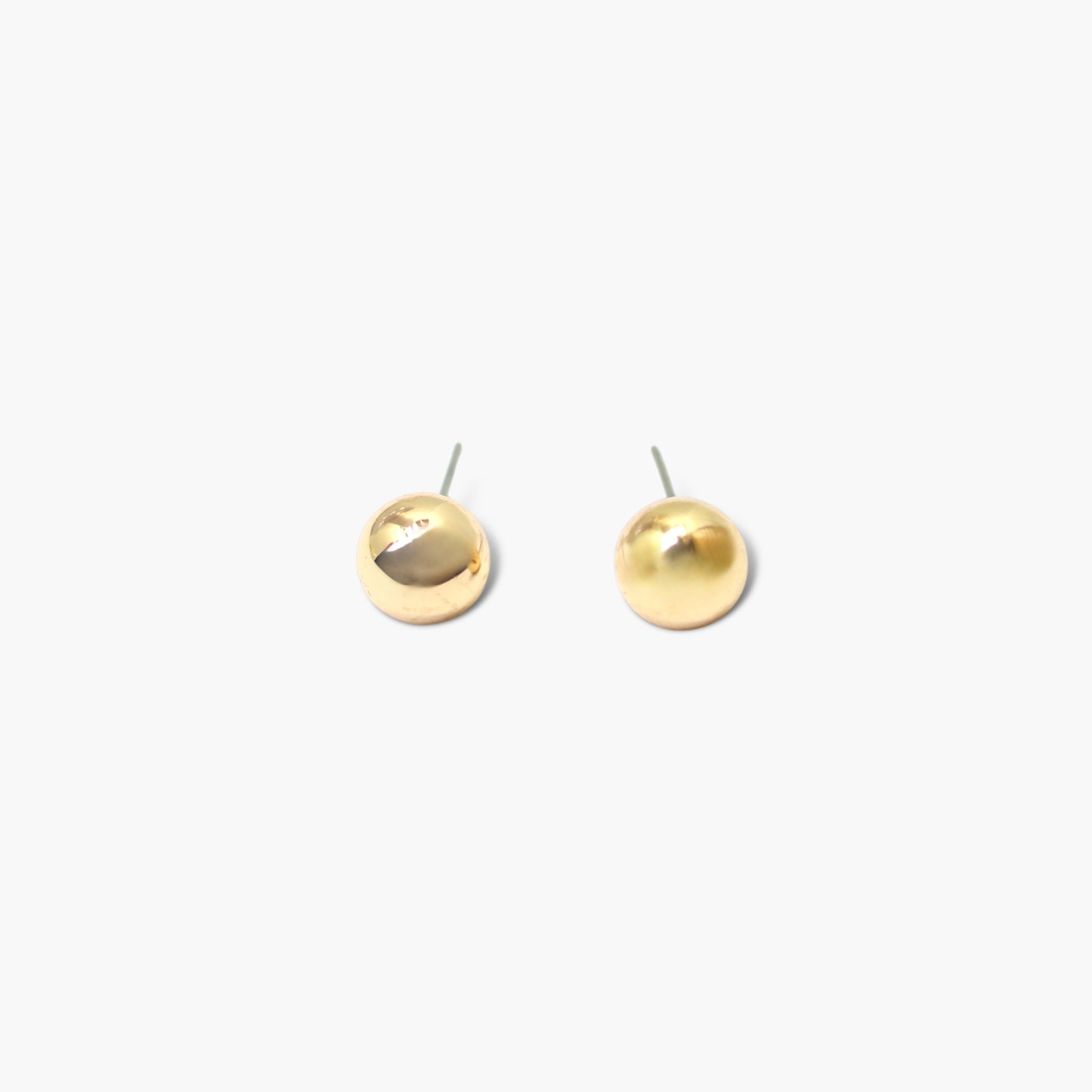 A pair of gold earrings on a white background