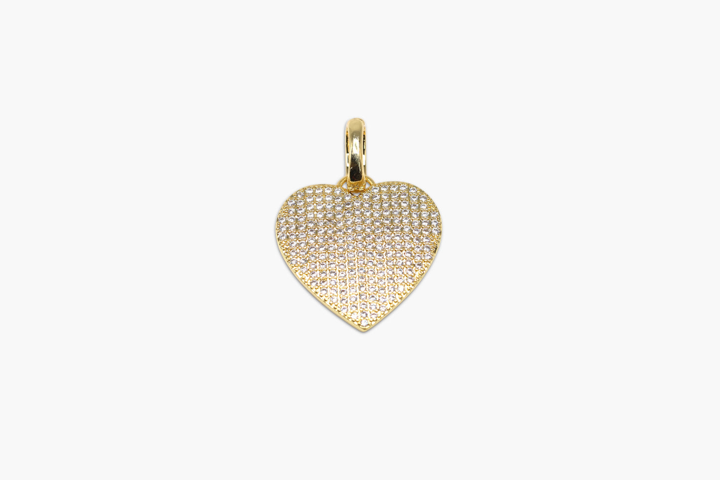 Gold heart-shaped pendant on a white background