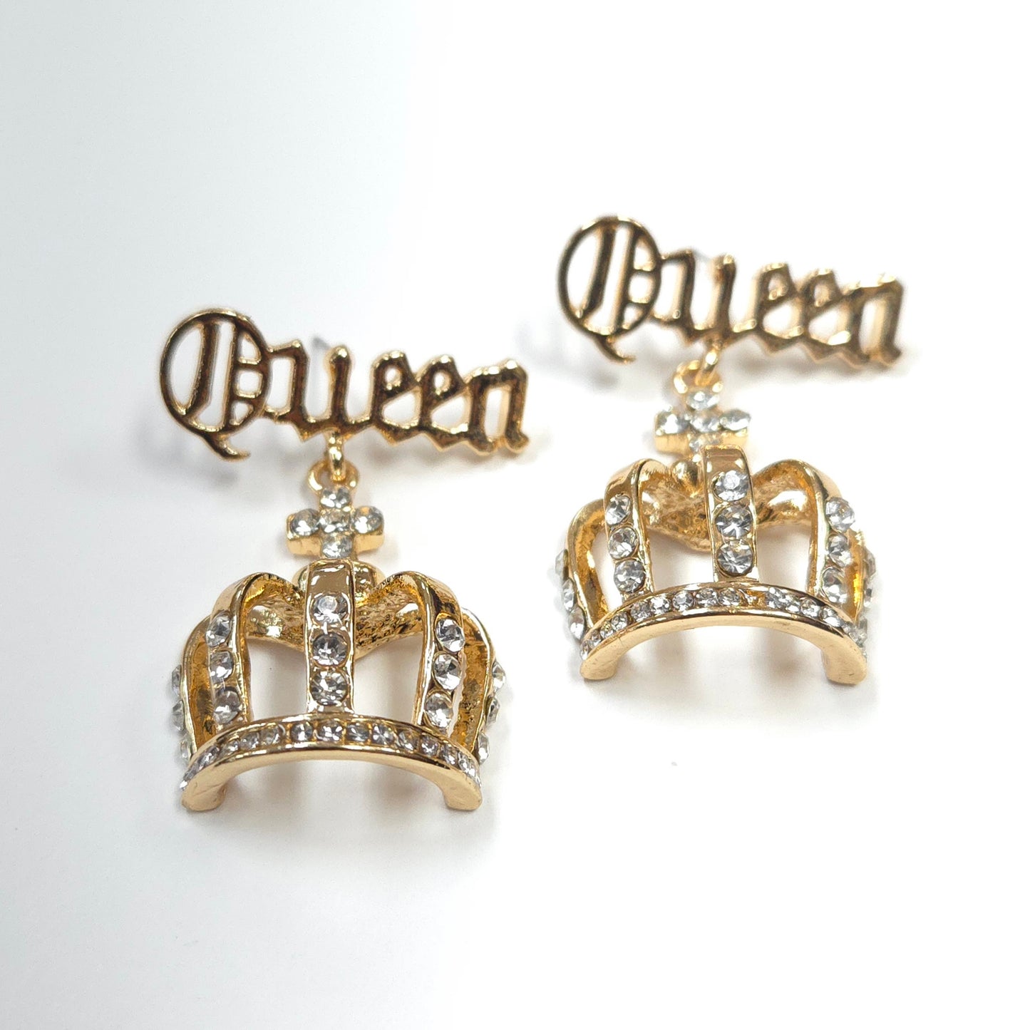 Gold crown earrings with 'Princess' text on a white background