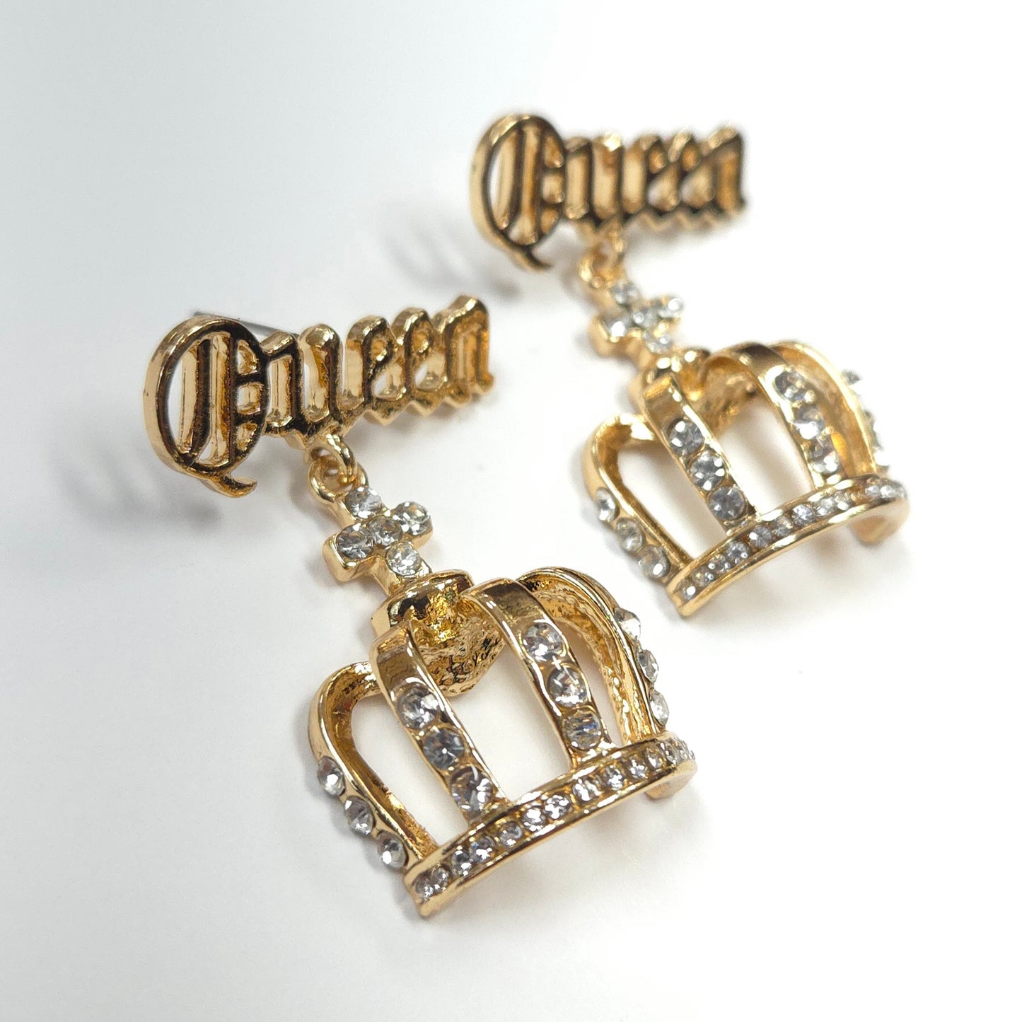 Gold crown earrings with 'Princess' text on a white background