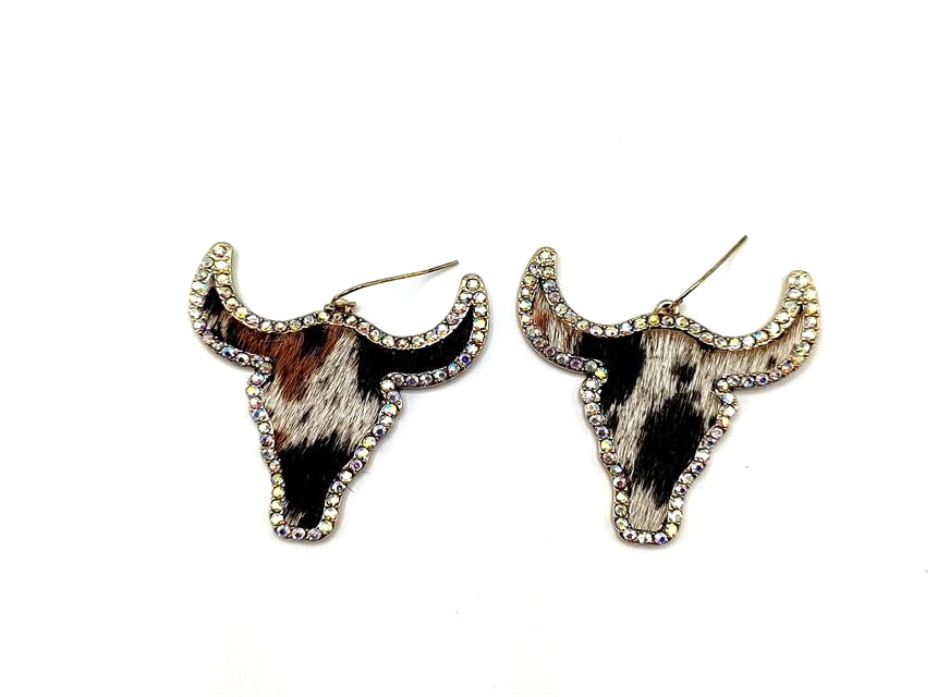 A pair of bull-head earrings on a white background
