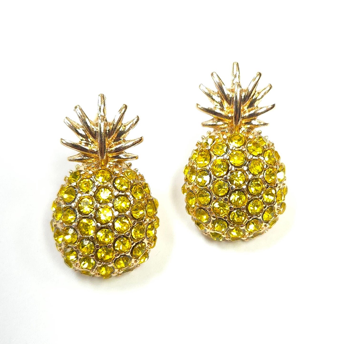 Pineapple-shaped earrings with yellow gemstones on a white background