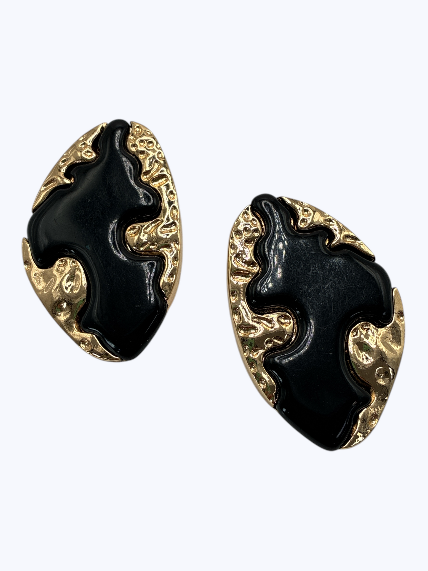 Modern abstract drop earrings featuring sculptural metallic base with bold organic enamel overlay design.
